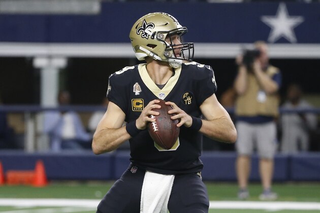 New Orleans Saints quarterback Drew Brees (9) looks to throw against the Dallas Cowboys in the first half of an NFL football game, in Arlington, Texas, Thursday, Nov. 29, 2018. (AP Photo/Ron Jenkins)