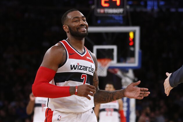 Washington Wizards' John Wall celebrates during the fourth quarter of an NBA basketball game against the New York Knicks Monday, Dec. 3, 2018, in New York. (AP Photo/Jason DeCrow)