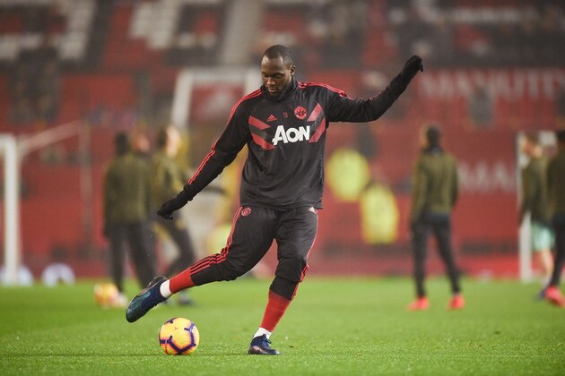 Manchester United's Belgian striker Romelu Lukaku warms up for the English Premier League football match between Manchester United and Arsenal at Old Trafford in Manchester, north west England, on December 5, 2018. (Photo by Oli SCARFF / AFP) / RESTRICTED TO EDITORIAL USE. No use with unauthorized audio, video, data, fixture lists, club/league logos or 'live' services. Online in-match use limited to 120 images. An additional 40 images may be used in extra time. No video emulation. Social media in-match use limited to 120 images. An additional 40 images may be used in extra time. No use in betting publications, games or single club/league/player publications. /         (Photo credit should read OLI SCARFF/AFP/Getty Images)
