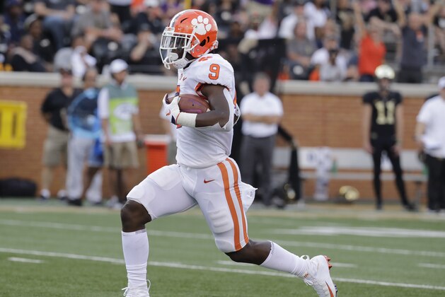 Clemson's Travis Etienne (9) runs for a touchdown against Wake Forest during the first half of an NCAA college football game in Charlotte, N.C., Saturday, Oct. 6, 2018. (AP Photo/Chuck Burton) Clemson's Travis Etienne (9) runs for a touchdown against Wake Forest during the first half of an NCAA college football game in Charlotte, N.C., Saturday, Oct. 6, 2018. (AP Photo/Chuck Burton)