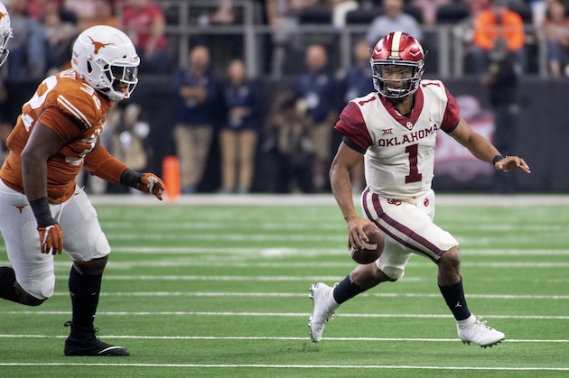 Oklahoma quarterback Kyler Murray (1) scrambles away from Texas defensive lineman Malcolm Roach (32) during the first half of the Big 12 Conference championship NCAA college football game on Saturday, Dec. 1, 2018, in Arlington, Texas. (AP Photo/Jeffrey McWhorter)