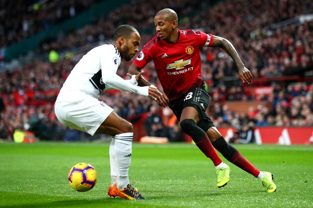 MANCHESTER, ENGLAND - DECEMBER 08:  Ashley Young of Manchester United is challenged by Denis Odoi of Fulham during the Premier League match between Manchester United and Fulham FC at Old Trafford on December 8, 2018 in Manchester, United Kingdom.  (Photo by Clive Brunskill/Getty Images)