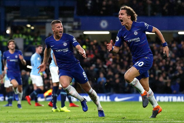Chelsea's Brazilian defender David Luiz (R) celebrates with Chelsea's English midfielder Ross Barkley after scoring their second goal during the English Premier League football match between Chelsea and Manchester City at Stamford Bridge in London on December 8, 2018. (Photo by Adrian DENNIS / AFP) / RESTRICTED TO EDITORIAL USE. No use with unauthorized audio, video, data, fixture lists, club/league logos or 'live' services. Online in-match use limited to 120 images. An additional 40 images may be used in extra time. No video emulation. Social media in-match use limited to 120 images. An additional 40 images may be used in extra time. No use in betting publications, games or single club/league/player publications. /         (Photo credit should read ADRIAN DENNIS/AFP/Getty Images)