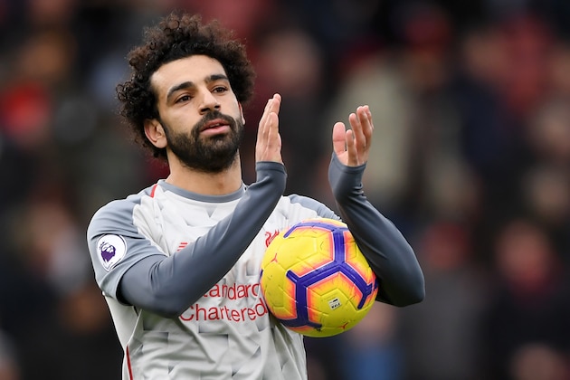 BOURNEMOUTH, ENGLAND - DECEMBER 08:  Mohamed Salah of Liverpool collects the match ball after scoring a hattrick and acknowledges the fans after the Premier League match between AFC Bournemouth and Liverpool FC at Vitality Stadium on December 8, 2018 in Bournemouth, United Kingdom.  (Photo by Mike Hewitt/Getty Images)