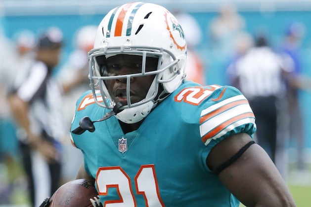 Miami Dolphins running back Frank Gore (21) warms up, before an NFL football game against the Buffalo Bills, Sunday, Dec. 2, 2018, in Miami Gardens, Fla. (AP Photo/Joel Auerbach)