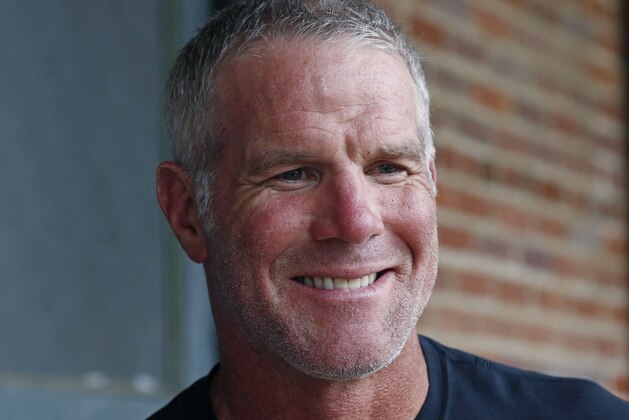 NFL Hall of Fame quarterback Brett Favre speaks with reporters about his support for Willowood Developmental Center, a facility that provides training and assistance for special needs students, Wednesday, Oct. 17, 2018 in Jackson, Miss. Favre, whose mother has a degree in special education, said he is a few hours short of graduating from Southern Mississippi and is being encouraged by his mother to obtain his degree. (AP Photo/Rogelio V. Solis)