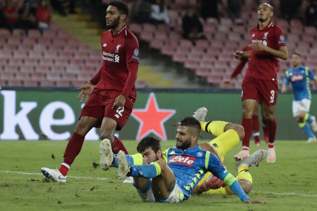 Napoli forward Lorenzo Insigne, bottom, scores during the Champions League, group C soccer match between Napoli and Liverpool, at the San Paolo Stadium in Naples, Italy, Wednesday, Oct. 3, 2018. Napoli won 1-0. (AP Photo/Andrew Medichini)