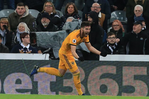 Wolverhampton Wanderers' Irish defender Matt Doherty celebrates after scoring their late winner during the English Premier League football match between Newcastle United and Wolverhampton Wanderers at St James' Park in Newcastle-upon-Tyne, north east England on December 9, 2018. - Wolves won the game 2-1. (Photo by Lindsey PARNABY / AFP) / RESTRICTED TO EDITORIAL USE. No use with unauthorized audio, video, data, fixture lists, club/league logos or 'live' services. Online in-match use limited to 120 images. An additional 40 images may be used in extra time. No video emulation. Social media in-match use limited to 120 images. An additional 40 images may be used in extra time. No use in betting publications, games or single club/league/player publications. /         (Photo credit should read LINDSEY PARNABY/AFP/Getty Images)