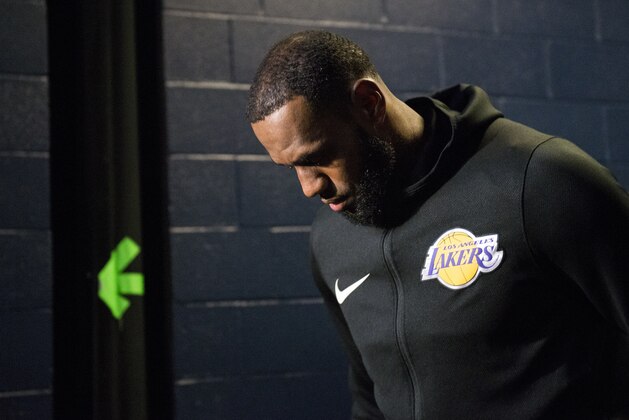 Los Angeles Lakers forward LeBron James walks to the court before an NBA basketball game against the Memphis Grizzlies on Saturday, Dec. 8, 2018, in Memphis, Tenn. (AP Photo/Brandon Dill)