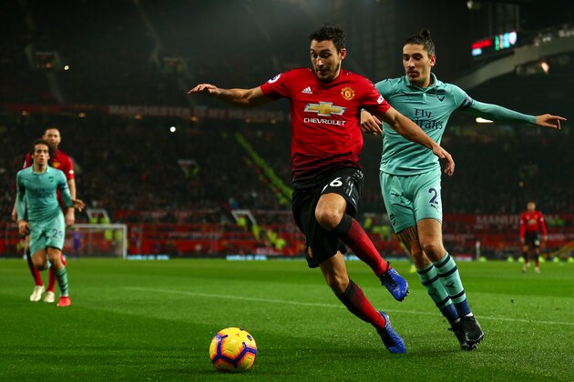 MANCHESTER, ENGLAND - DECEMBER 05:  Matteo Darmian of Manchester United and Hector Bellerin of Arsenal during the Premier League match between Manchester United and Arsenal FC at Old Trafford on December 5, 2018 in Manchester, United Kingdom. (Photo by Robbie Jay Barratt - AMA/Getty Images)