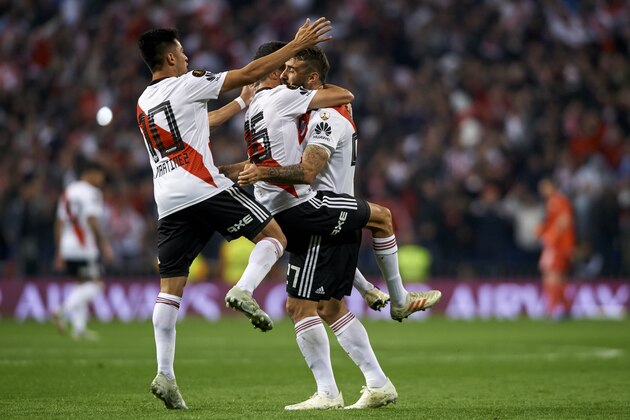 MADRID, SPAIN - DECEMBER 09: Lucas Pratto of River Plate celebrates with his team-mates after scoring his team's first goal during the second leg of the final match of Copa CONMEBOL Libertadores 2018 between Boca Juniors and River Plate at Estadio Santiago Bernabeu on December 09, 2018 in Madrid, Spain. (Photo by Quality Sport Images/Getty Images,)