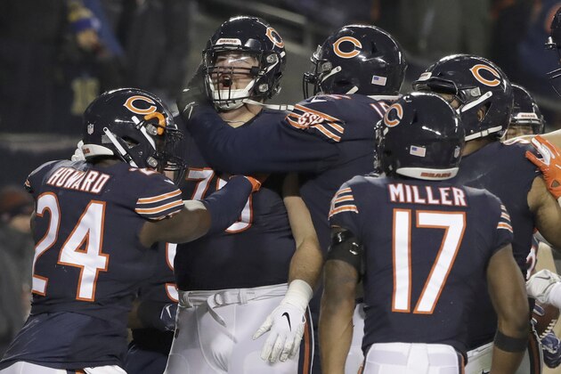 Chicago Bears offensive tackle Bradley Sowell (79) celebrates a touchdown reception with teammates during the second half of an NFL football game against the Los Angeles Rams Sunday, Dec. 9, 2018, in Chicago. (AP Photo/Nam Y. Huh)