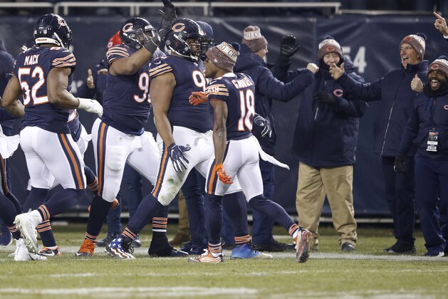 CHICAGO, IL - DECEMBER 09:  Akiem Hicks #96 of the Chicago Bears (middle) celebrates with teammates after sacking quarterback Jared Goff #16 of the Los Angeles Rams in the fourth quarter at Soldier Field on December 9, 2018 in Chicago, Illinois.  (Photo by Joe Robbins/Getty Images)