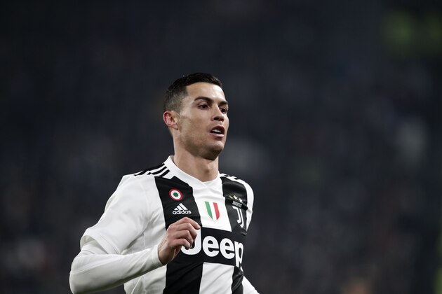 Juventus' Portuguese forward Cristiano Ronaldo runs with the ball during the Serie A soccer match Juventus vs InterMilan at the Stadio delle Alpi in Turin on December 7, 2018. (Photo by Isabella BONOTTO / AFP)        (Photo credit should read ISABELLA BONOTTO/AFP/Getty Images)