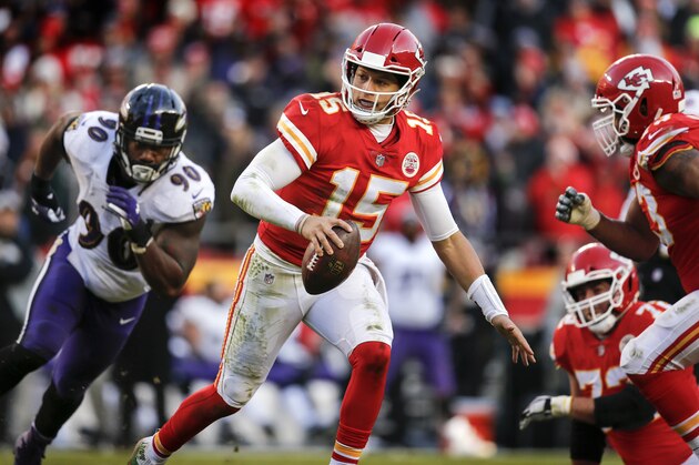 KANSAS CITY, MO - DECEMBER 09: Quarterback Patrick Mahomes #15 of the Kansas City Chiefs scrambles away from outside linebacker Za'Darius Smith #90 of the Baltimore Ravens in overtime at Arrowhead Stadium on December 9, 2018 in Kansas City, Missouri. The Chiefs won, 27-24.  (Photo by David Eulitt/Getty Images)