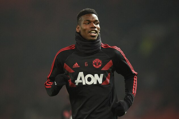 Manchester United's French midfielder Paul Pogba warms up before kick off of the English Premier League football match between Manchester United and Arsenal at Old Trafford in Manchester, north west England, on December 5, 2018. (Photo by Oli SCARFF / AFP) / RESTRICTED TO EDITORIAL USE. No use with unauthorized audio, video, data, fixture lists, club/league logos or 'live' services. Online in-match use limited to 120 images. An additional 40 images may be used in extra time. No video emulation. Social media in-match use limited to 120 images. An additional 40 images may be used in extra time. No use in betting publications, games or single club/league/player publications. /         (Photo credit should read OLI SCARFF/AFP/Getty Images)