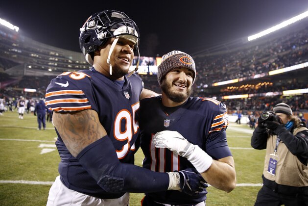 CHICAGO, IL - DECEMBER 09: Roy Robertson-Harris #95 and quarterback Mitchell Trubisky #10 of the Chicago Bears celebrate after defeating the Los Angeles Rams 15-6 at Soldier Field on December 9, 2018 in Chicago, Illinois. (Photo by Joe Robbins/Getty Images)