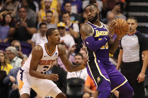 PHOENIX, AZ - OCTOBER 24:  LeBron James #23 of the Los Angeles Lakers handles the ball agianst Trevor Ariza #3 of the Phoenix Suns during the second half of the NBA game at Talking Stick Resort Arena on October 24, 2018 in Phoenix, Arizona.  The Lakers defeated the Suns 131-113. NOTE TO USER: User expressly acknowledges and agrees that, by downloading and or using this photograph, User is consenting to the terms and conditions of the Getty Images License Agreement.  (Photo by Christian Petersen/Getty Images)