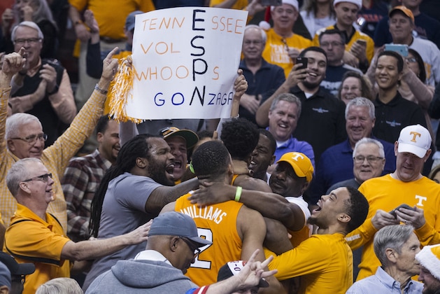 Tennessee's Admiral Schofield (5) and Grant Williams (2) goes into the crowd to celebrate with fans their win over Gonzaga in an NCAA college basketball game Sunday, Dec. 9, 2018, in Phoenix. (AP Photo/Darryl Webb)