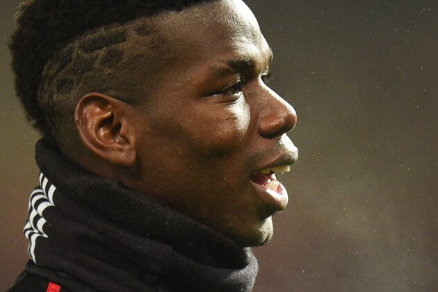 Manchester United's French midfielder Paul Pogba warms up before kick off of the English Premier League football match between Manchester United and Arsenal at Old Trafford in Manchester, north west England, on December 5, 2018. (Photo by Oli SCARFF / AFP) / RESTRICTED TO EDITORIAL USE. No use with unauthorized audio, video, data, fixture lists, club/league logos or 'live' services. Online in-match use limited to 120 images. An additional 40 images may be used in extra time. No video emulation. Social media in-match use limited to 120 images. An additional 40 images may be used in extra time. No use in betting publications, games or single club/league/player publications. /         (Photo credit should read OLI SCARFF/AFP/Getty Images)