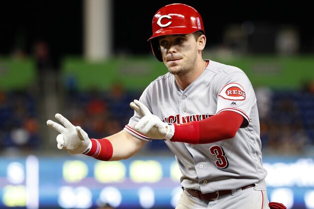 Cincinnati Reds' Scooter Gennett celebrates a base hit during the fourth inning of a baseball game against the Miami Marlins, Saturday, Sept. 22, 2018, in Miami. (AP Photo/Wilfredo Lee)