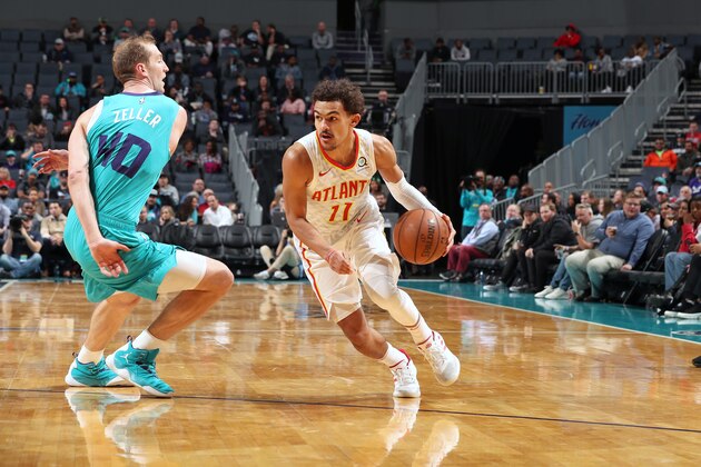 CHARLOTTE, NC - NOVEMBER 28: Trae Young #11 of the Atlanta Hawks handles the ball against the Charlotte Hornets on November 28, 2018 at the Spectrum Center in Charlotte, North Carolina. NOTE TO USER: User expressly acknowledges and agrees that, by downloading and/or using this photograph, user is consenting to the terms and conditions of the Getty Images License Agreement.  Mandatory Copyright Notice: Copyright 2018 NBAE (Photo by Kent Smith/NBAE via Getty Images)