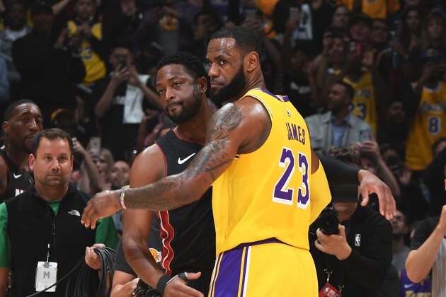 LOS ANGELES, CA - DECEMBER 10: Dwyane Wade #3 of the Miami Heat and LeBron James #23 of the Los Angeles Lakers hug during the game between the two teams on December 10, 2018 at STAPLES Center in Los Angeles, California. NOTE TO USER: User expressly acknowledges and agrees that, by downloading and/or using this Photograph, user is consenting to the terms and conditions of the Getty Images License Agreement. Mandatory Copyright Notice: Copyright 2018 NBAE (Photo by Andrew D. Bernstein/NBAE via Getty Images)