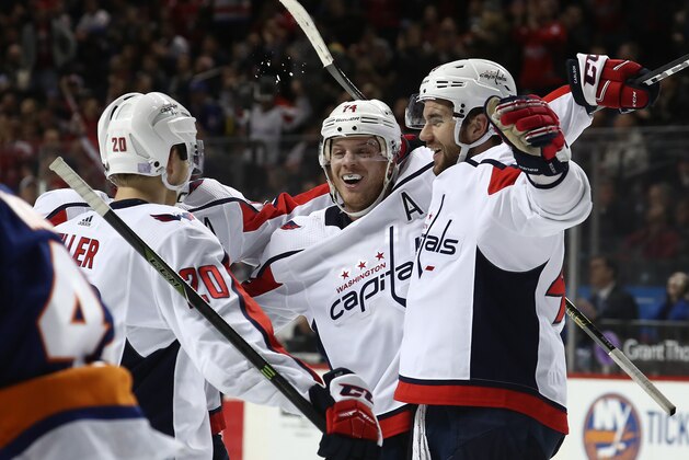 NEW YORK, NEW YORK - NOVEMBER 26: Tom Wilson #43 of the Washington Capitals celebrates his goal in the third period with Lars Eller #20 and John Carlson #74 during their game against the New York Islandersat the Barclays Center on November 26, 2018 in New York City. (Photo by Al Bello/Getty Images)