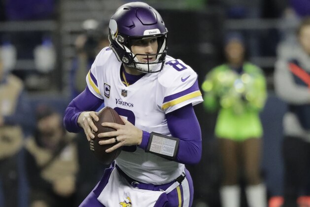 Minnesota Vikings quarterback Kirk Cousins scrambles against the Seattle Seahawks in the first half of an NFL football game, Monday, Dec. 10, 2018, in Seattle. (AP Photo/Ted S. Warren)