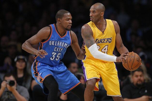 Los Angeles Lakers' Kobe Bryant, right, is defended by Oklahoma City Thunder's Kevin Durant during the first half of an NBA basketball game, Wednesday, Dec. 23, 2015, in Los Angeles. (AP Photo/Jae C. Hong)