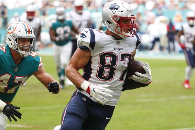 New England Patriots tight end Rob Gronkowski (87) runs the ball ahead of Miami Dolphins outside linebacker Kiko Alonso (47), during the first half of an NFL football game, Sunday, Dec. 9, 2018, in Miami Gardens, Fla. (AP Photo/Wilfredo Lee)