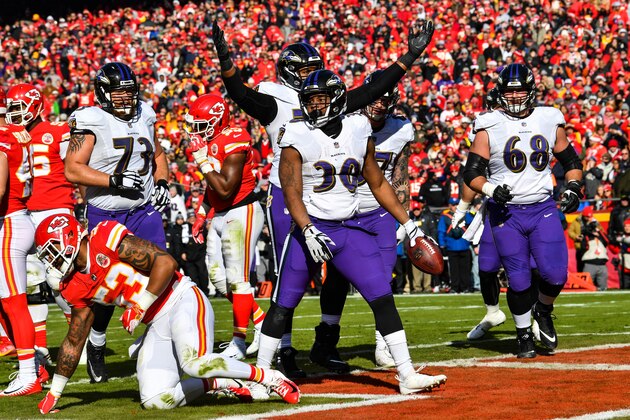 KANSAS CITY, MO - DECEMBER 9: Kenneth Dixon #30 of the Baltimore Ravens celebrates after scoring the teams first touchdown in the second quarter of the game against the Kansas City Chiefs at Arrowhead Stadium on December 9, 2018 in Kansas City, Missouri. (Photo by Peter Aiken/Getty Images)
