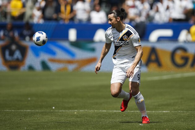 Los Angeles Galaxy's Zlatan Ibrahimovic, of Sweden, dribbles the ball during the second half of an MLS soccer match against the Los Angeles FC Saturday, March 31, 2018, in Carson, Calif. (AP Photo/Jae C. Hong)
