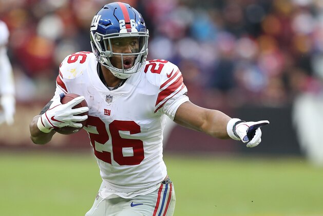 LANDOVER, MD - DECEMBER 09: Running back Saquon Barkley #26 of the New York Giants carries the ball in the second quarter against the Washington Redskins at FedExField on December 9, 2018 in Landover, Maryland. (Photo by Rob Carr/Getty Images)