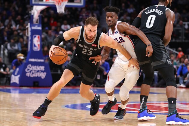 DETROIT, MICHIGAN - DECEMBER 07:  Blake Griffin #23 of the Detroit Pistons tries to drive around Jimmy Butler #23 of the Philadelphia 76ers during the second half at Little Caesars Arena on December 07, 2018 in Detroit, Michigan. Philadelphia won the game 117-111. NOTE TO USER: User expressly acknowledges and agrees that, by downloading and or using this photograph, User is consenting to the terms and conditions of the Getty Images License  (Photo by Gregory Shamus/Getty Images)