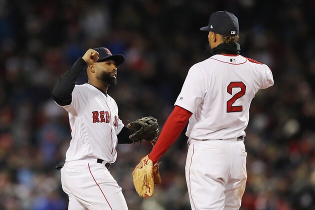 BOSTON, MA - OCTOBER 24:  Jackie Bradley Jr. #19 and Xander Bogaerts #2 of the Boston Red Sox celebrate their teams 4-2 win over the Los Angeles Dodgers in Game Two of the 2018 World Series at Fenway Park on October 24, 2018 in Boston, Massachusetts.  (Photo by Elsa/Getty Images)