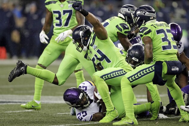 Seattle Seahawks' Bobby Wagner (54) raises his fist after stopping Minnesota Vikings' Latavius Murray on a fourth down run in the second half of an NFL football game, Monday, Dec. 10, 2018, in Seattle. (AP Photo/Stephen Brashear)