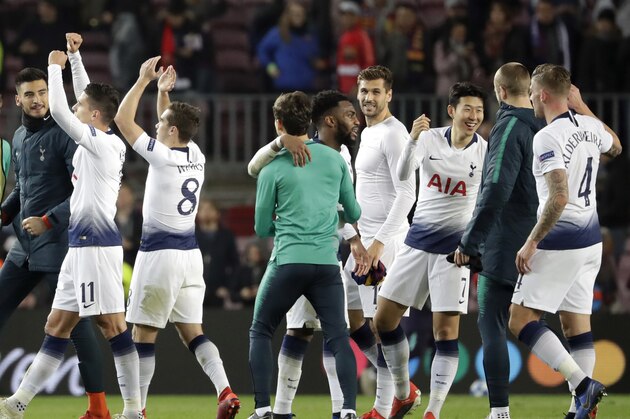 Tottenham players celebrate at the end of the Champions League group B soccer match between FC Barcelona and Tottenham Hotspur at the Camp Nou stadium in Barcelona, Spain, Tuesday, Dec. 11, 2018. (AP Photo/Emilio Morenatti)