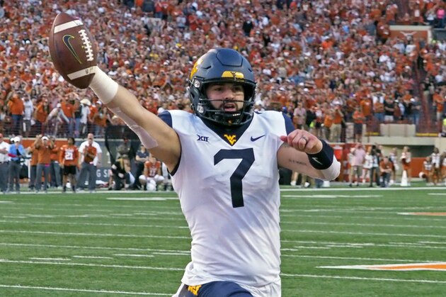 West Virginia quarterback Will Grier runs in the game winning two point conversion with 16 second to go in an NCAA college football game against Texas, Saturday, Nov. 3, 2018, in Austin, Texas. West Virginia won 42-41. (AP Photo/Michael Thomas)