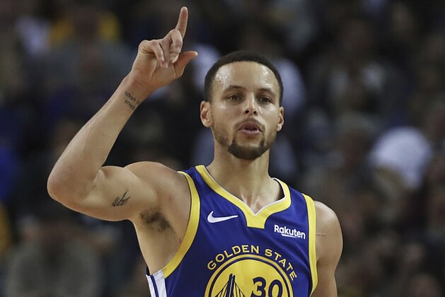Golden State Warriors' Stephen Curry celebrates a score against the Minnesota Timberwolves in the second half of an NBA basketball game, Monday, Dec. 10, 2018, in Oakland, Calif. (AP Photo/Ben Margot)