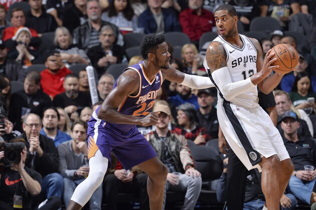 SAN ANTONIO, TX - DECEMBER 11: Deandre Ayton #22 of the Phoenix Suns plays defense against LaMarcus Aldridge #12 of the San Antonio Spurs on December 11, 2018 at the AT&T Center in San Antonio, Texas. NOTE TO USER: User expressly acknowledges and agrees that, by downloading and or using this photograph, user is consenting to the terms and conditions of the Getty Images License Agreement. Mandatory Copyright Notice: Copyright 2018 NBAE (Photos by Mark Sobhani/NBAE via Getty Images)