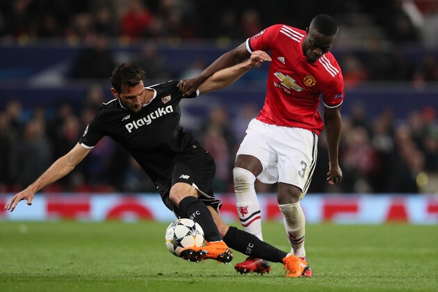 MANCHESTER, ENGLAND - MARCH 13: Franco Vanquez of Sevilla and Eric Bailly of Manchester United during the UEFA Champions League Round of 16 Second Leg match between Manchester United and Sevilla FC at Old Trafford on March 13, 2018 in Manchester, United Kingdom. (Photo by Matthew Ashton - AMA/Getty Images)