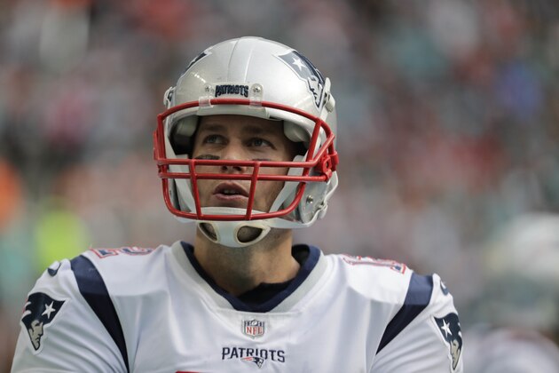 New England Patriots quarterback Tom Brady (12) stands on the sidelines, during the first half of an NFL football game against the Miami Dolphins, Sunday, Dec. 9, 2018, in Miami Gardens, Fla. (AP Photo/Lynne Sladky)