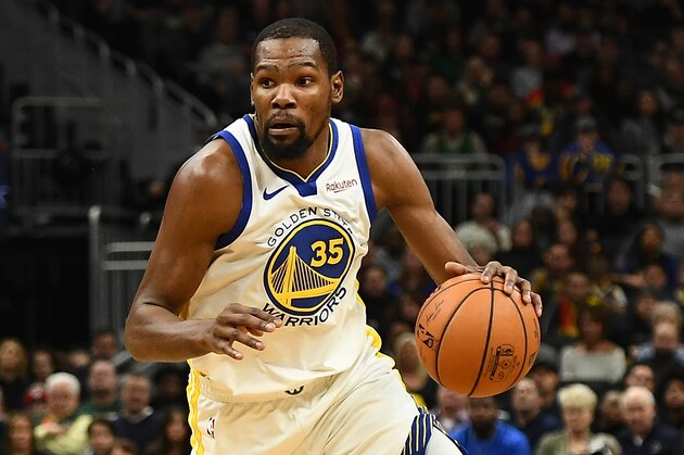 MILWAUKEE, WISCONSIN - DECEMBER 07: Kevin Durant #35 of the Golden State Warriors handles the ball during a game against the Milwaukee Bucks at Fiserv Forum on December 07, 2018 in Milwaukee, Wisconsin. The Warriors defeated the Bucks 105-95.  NOTE TO USER: User expressly acknowledges and agrees that, by downloading and or using this photograph, User is consenting to the terms and conditions of the Getty Images License Agreement.   (Photo by Stacy Revere/Getty Images)