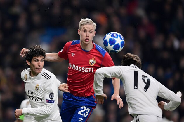 CSKA Moscow's Icelandic midfielder Hordur Magnusson (C) vies with Real Madrid's Spanish defender Jesus Vallejo (L) and Real Madrid's Spanish defender Alvaro Odriozola during the UEFA Champions League group G football match between Real Madrid CF and CSKA Moscow at the Santiago Bernabeu stadium in Madrid on December 12, 2018. (Photo by JAVIER SORIANO / AFP)        (Photo credit should read JAVIER SORIANO/AFP/Getty Images)