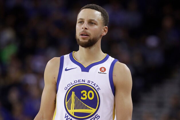 FILE - This March 6, 2018 file photo shows Golden State Warriors guard Stephen Curry during an NBA basketball game against the Brooklyn Nets in Oakland, Calif.  Sony Pictures Entertainment announced Monday, April 23, that it has struck a deal with the Golden State Warriors All-Star guard to produce television, film and possibly gaming projects. (AP Photo/Jeff Chiu, File)