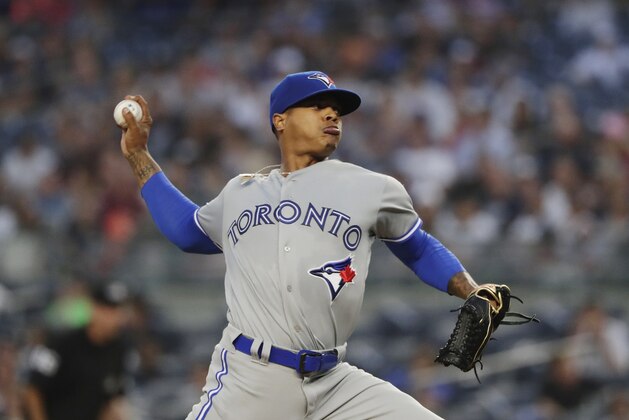Toronto Blue Jays' Marcus Stroman delivers a pitch during the first inning of a baseball game against the New York Yankees, Friday, Aug. 17, 2018, in New York. (AP Photo/Frank Franklin II)