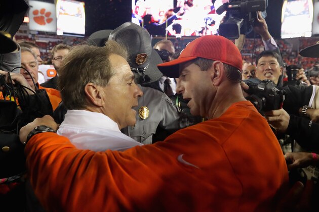 TAMPA, FL - JANUARY 09:  Head coach Nick Saban of the Alabama Crimson Tide talks with head coach Dabo Swinney of the Clemson Tigers after the Tigers defeated the Crimson Tide 35-31 in the 2017 College Football Playoff National Championship Game at Raymond James Stadium on January 9, 2017 in Tampa, Florida.  (Photo by Streeter Lecka/Getty Images)