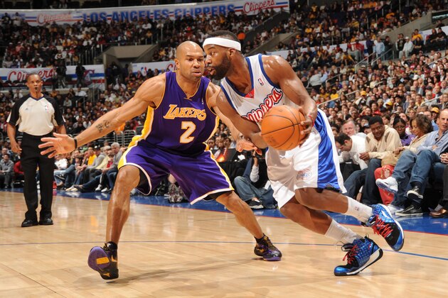LOS ANGELES - JANUARY 6:  Baron Davis #1 of the Los Angeles Clippers drives against Derek Fisher #2 of the Los Angeles Lakers at Staples Center on January 6, 2010 in Los Angeles, California. NOTE TO USER: User expressly acknowledges and agrees that, by downloading and/or using this Photograph, user is consenting to the terms and conditions of the Getty Images License Agreement. Mandatory Copyright Notice: Copyright 2010 NBAE (Photo by Andrew D. Bernstein/NBAE via Getty Images)
