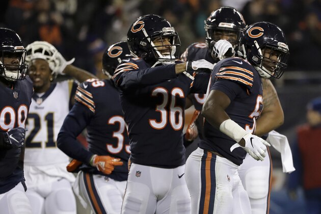 Chicago Bears inside linebacker Roquan Smith, right, celebrates with teammates after intercepting a pass during the first half of an NFL football game against the Los Angeles Rams Sunday, Dec. 9, 2018, in Chicago. (AP Photo/Nam Y. Huh)